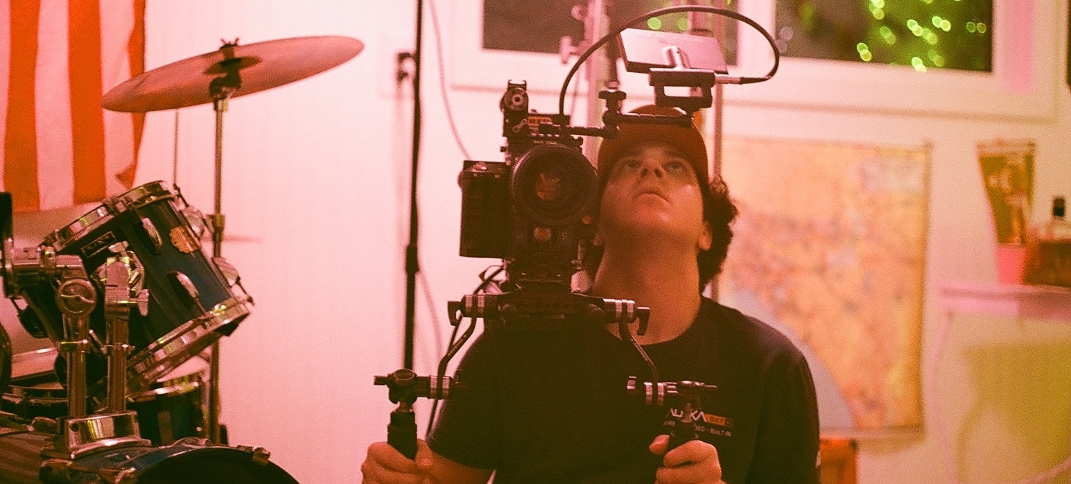 Camera operator filming on set of a production